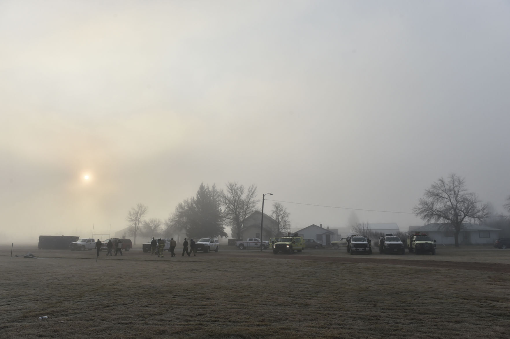 Firefighters deploy from the Denton City Park